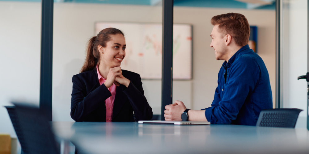 Co-workers engaging in feedback.