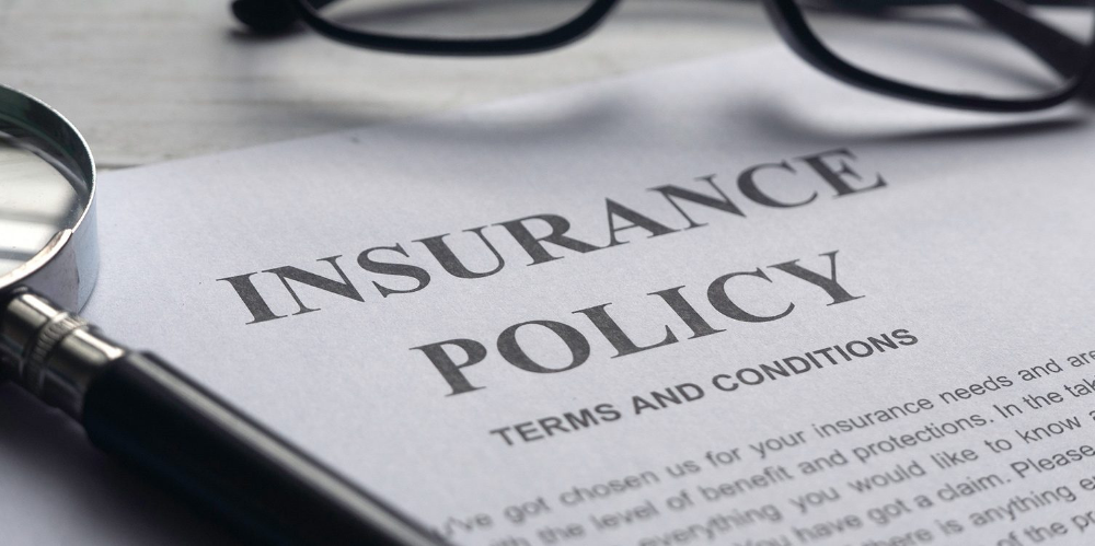 A photo of a close-up insurance policy, highligthing the words, 'Terms and Conditions'.