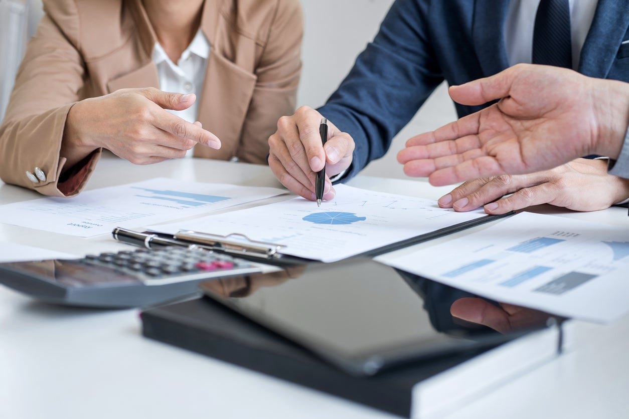 Group of partner working conversation, Business team meeting present with investor colleagues discussing plan financial graph data and analyzing strategy to growth up to profit into company.