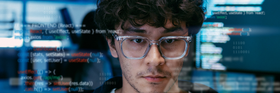Man looking at numbers on computer. 