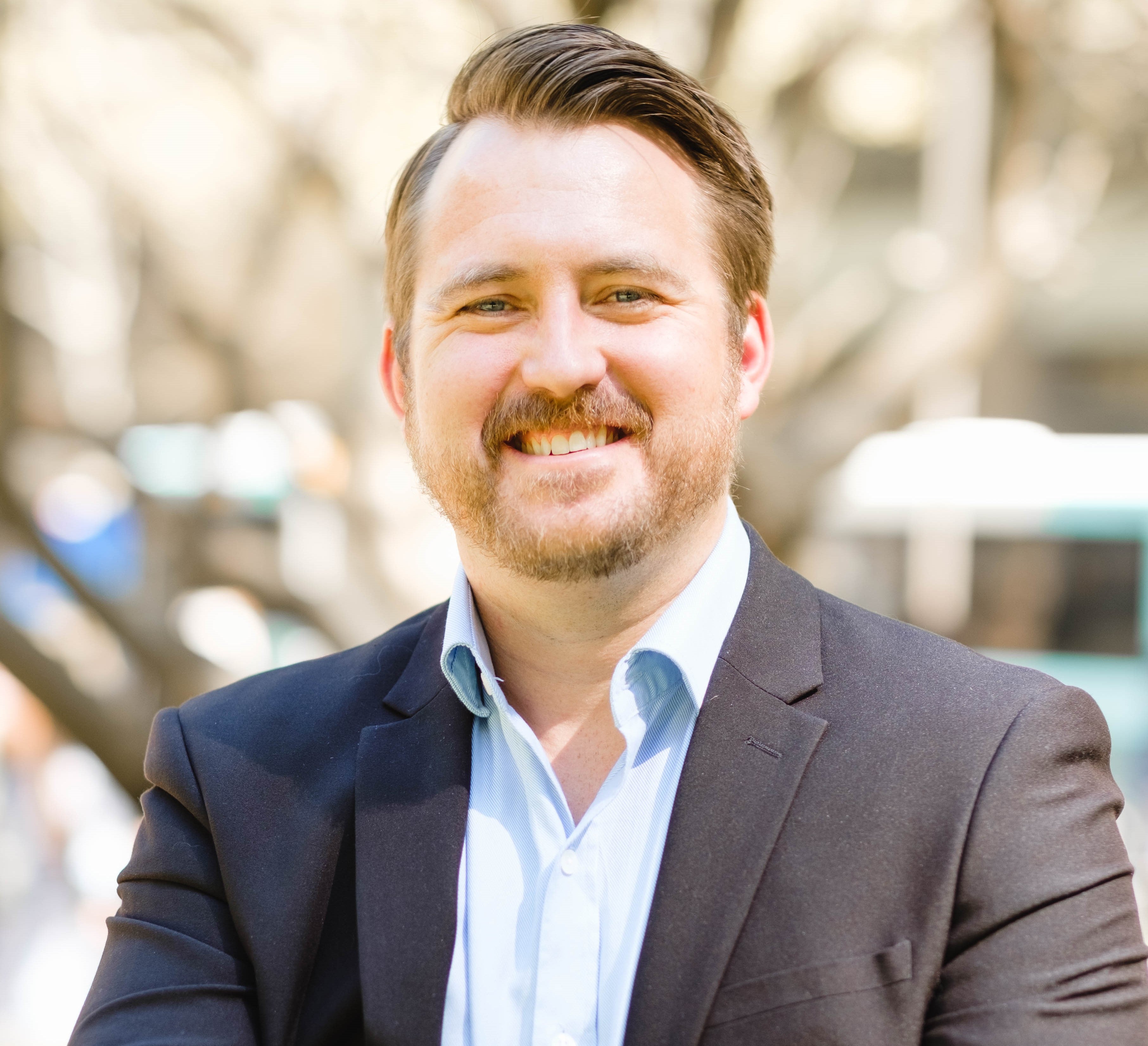 Headshot of a man wearing a suit 