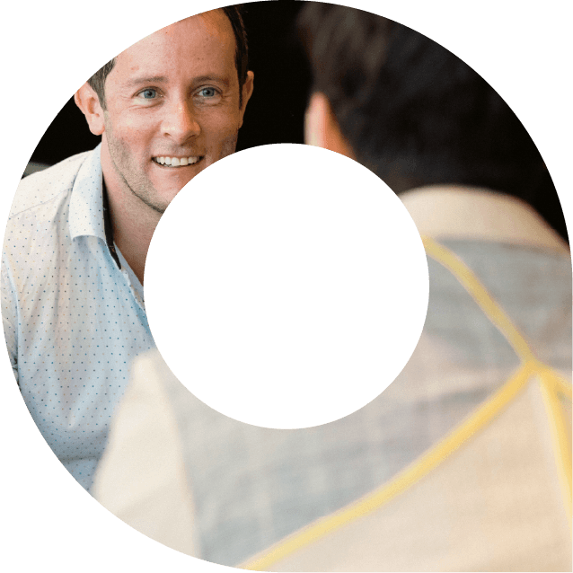 Two actuaries in discussion within viewfinder shape