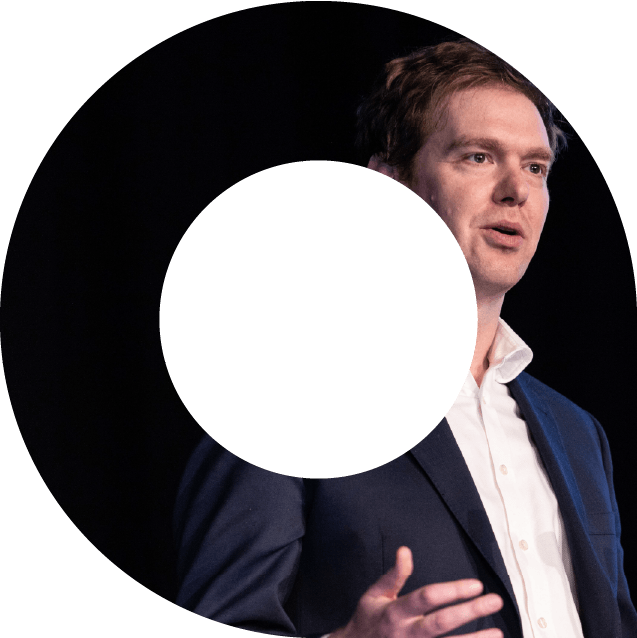 Actuary speaking on stage at an event in a viewfinder shape