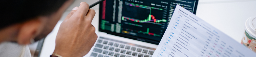 Man looking at information on computer screen.
