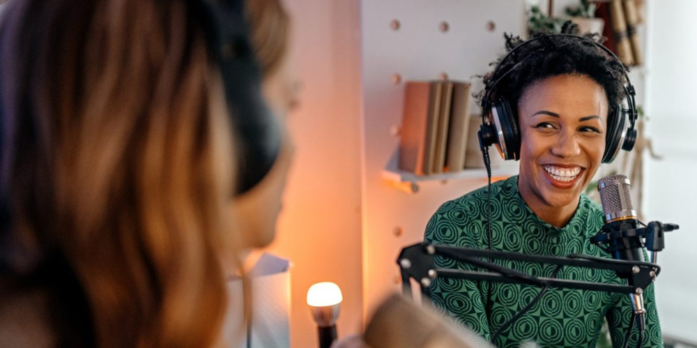 Two people hosting a podcast