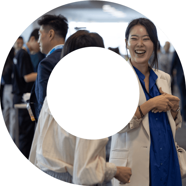 Three actuaries networking at an event. Photo is within a view finder