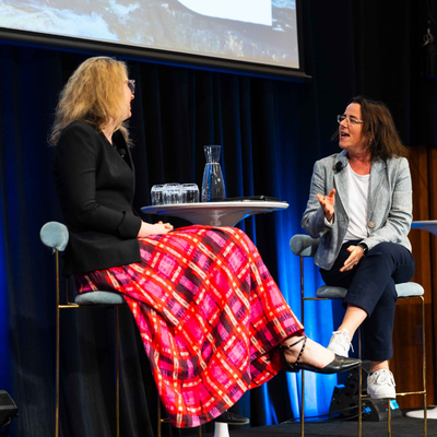 Danielle Wood and Elayne Grace in conversation on stage at the 2026 All Actuaries Summit, Melbourne Convention and Exhibition Centre.