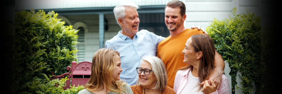 Image of grandparents and grandchildren smiling and facing each other