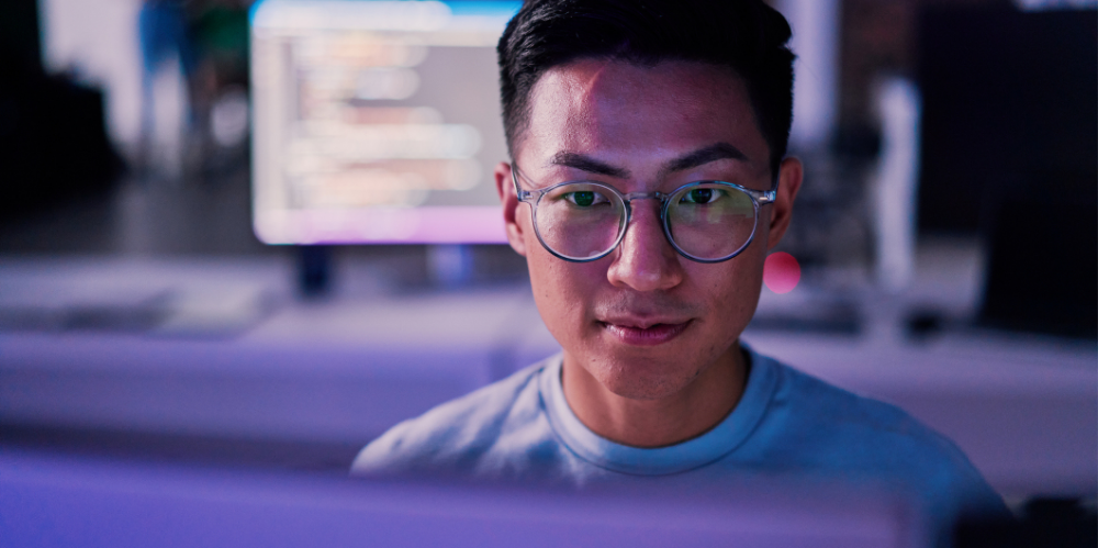 A man programming code in night office