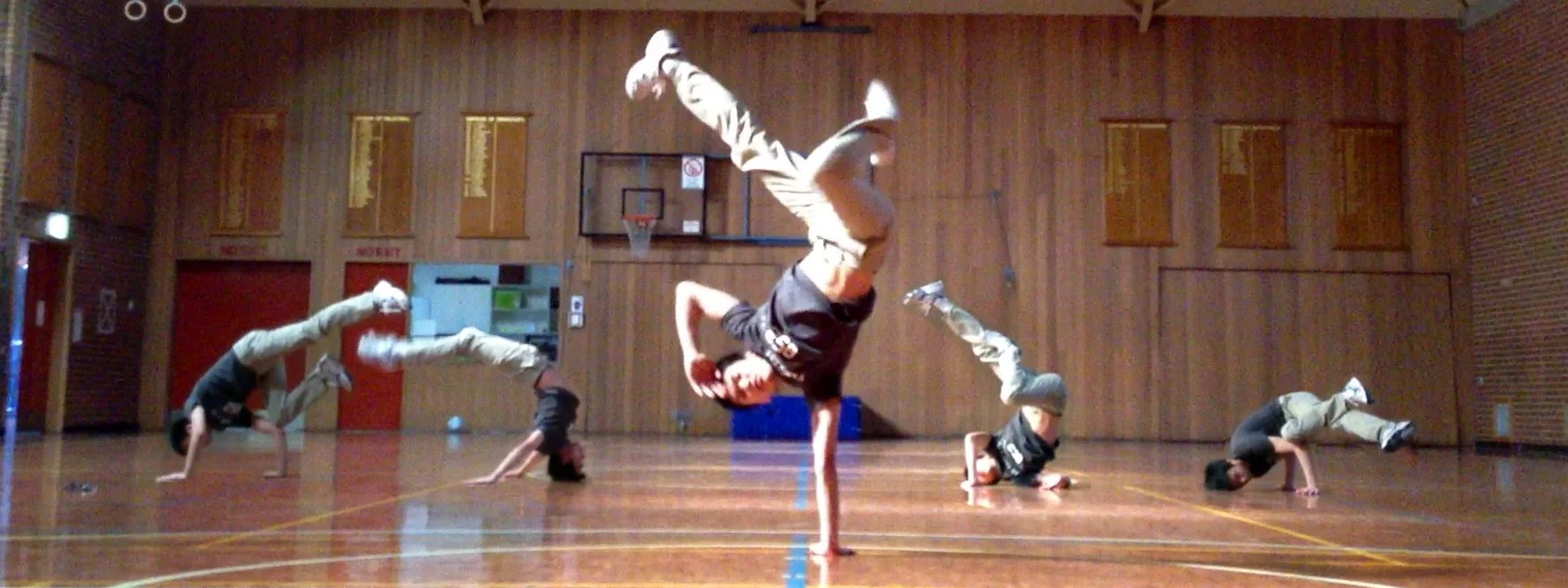 Garvin rehearsing his breakdancing routine prior to his retirement from the sport. All members of the photo are of Garvin.