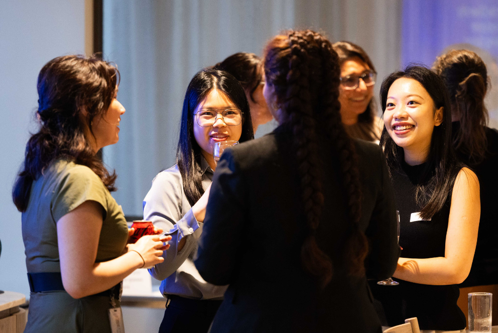 Group of women in a circle talking.