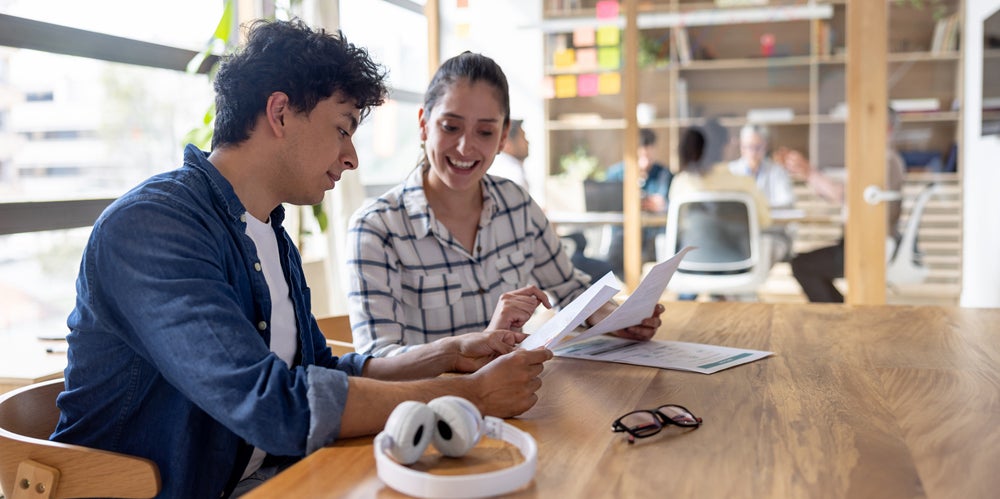 Man and woman sitting at a table studying