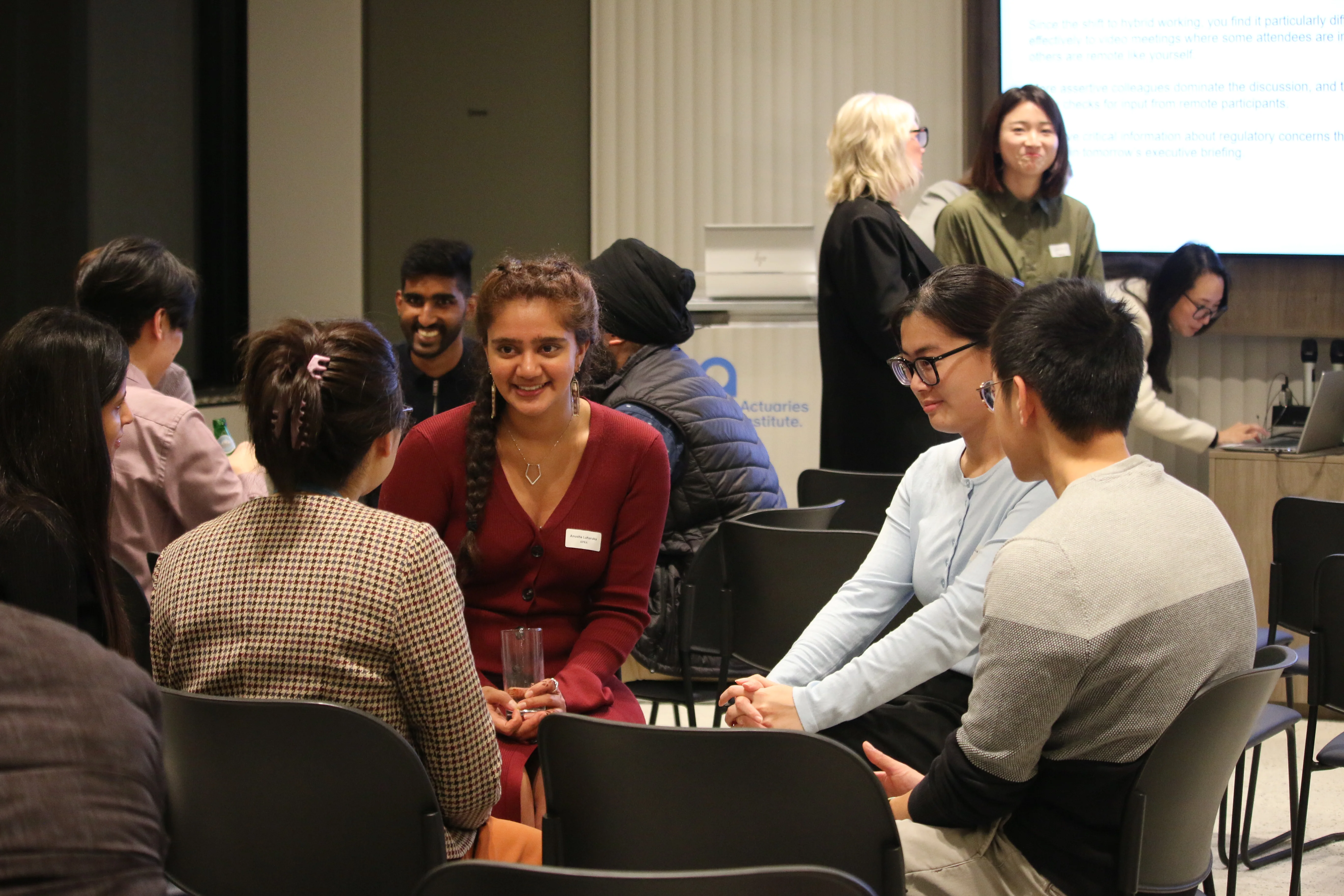 Session attendees discussing the case studies from the session.