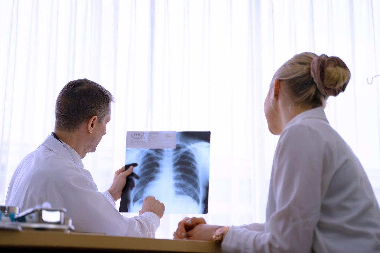 Doctors reviewing x-ray imagery. 