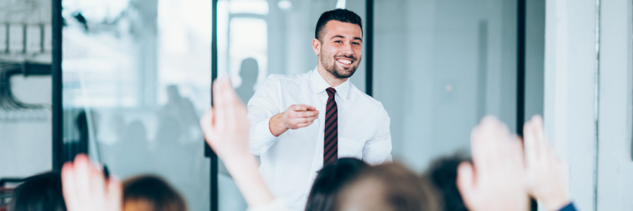 Man presenting at front of room