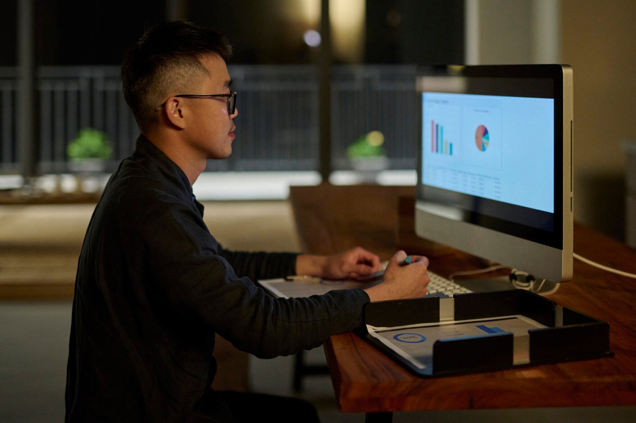 A small business owner work at night. Tea brand owner run his small business.