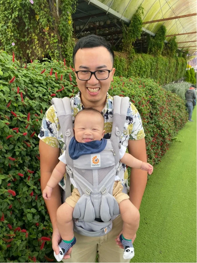 Samuel with his son, picking strawberries at Cameron Park.