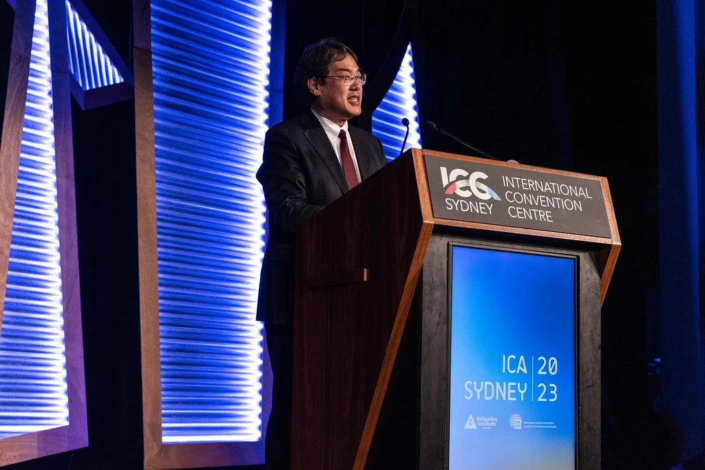 Hiroshi speaks at the ICA2023 closing ceremony in Sydney.