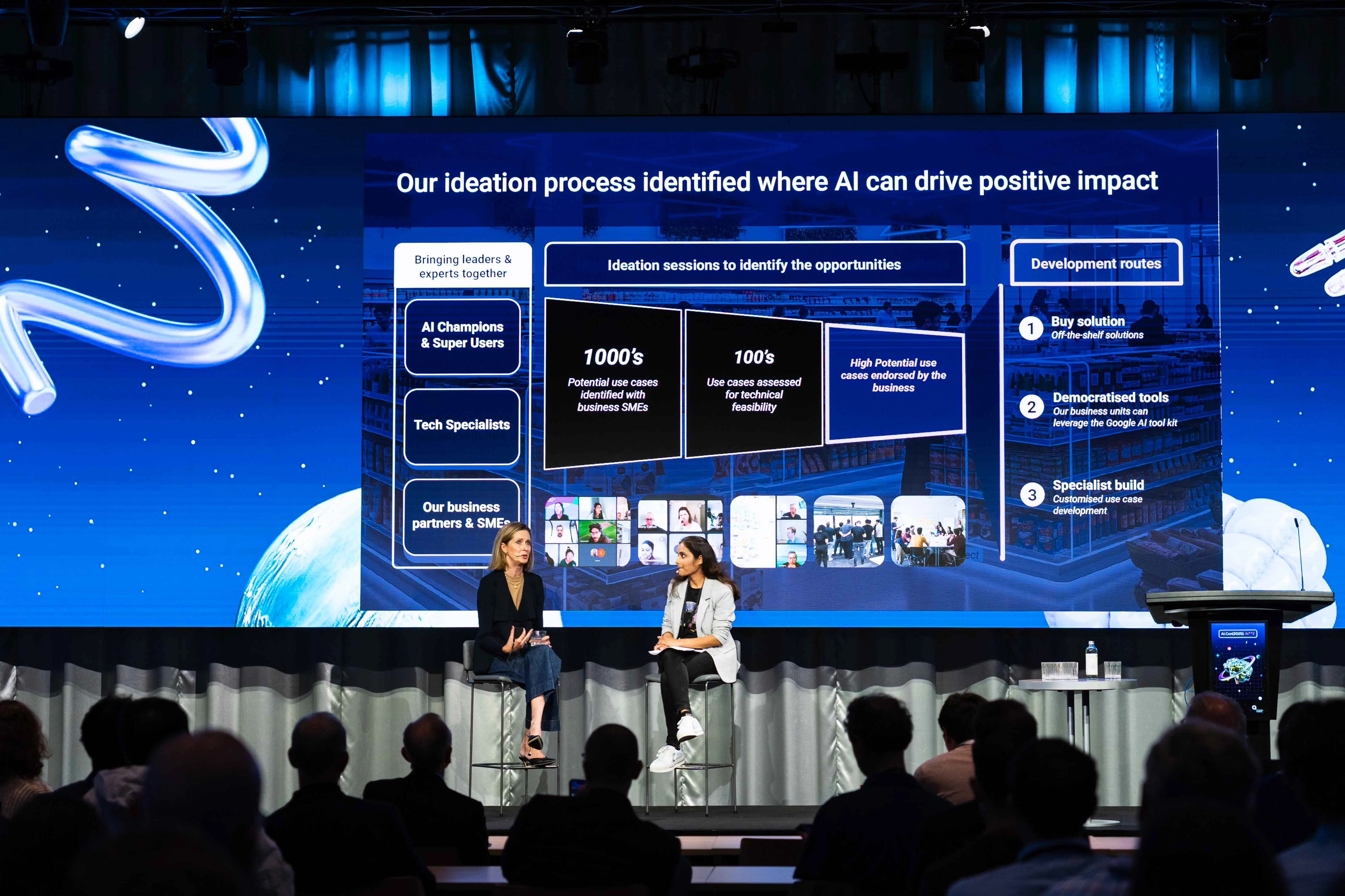 Left to right: Michelle Bauman and Utkarsha Ghule on stage at AI Con 2025. 