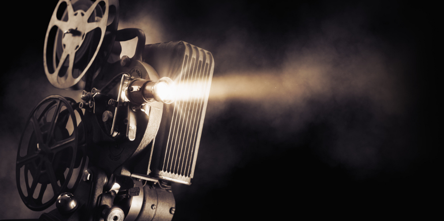 Film projector on dark background.