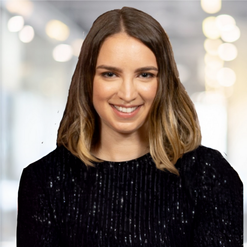 Women with long brown hair and sparkley jumper smiling at camera