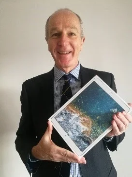 Guy Thorburn with his prize - an iPad