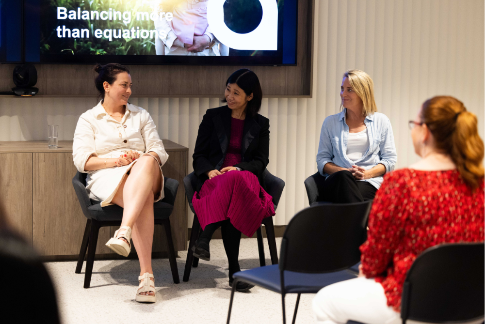 Panel of three women talking at an event