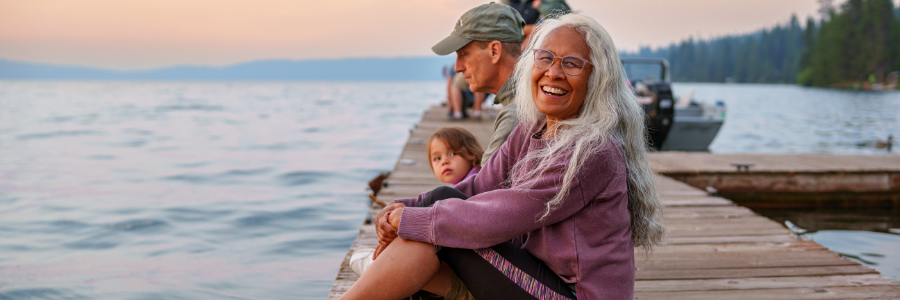 retired couple sit on a deck