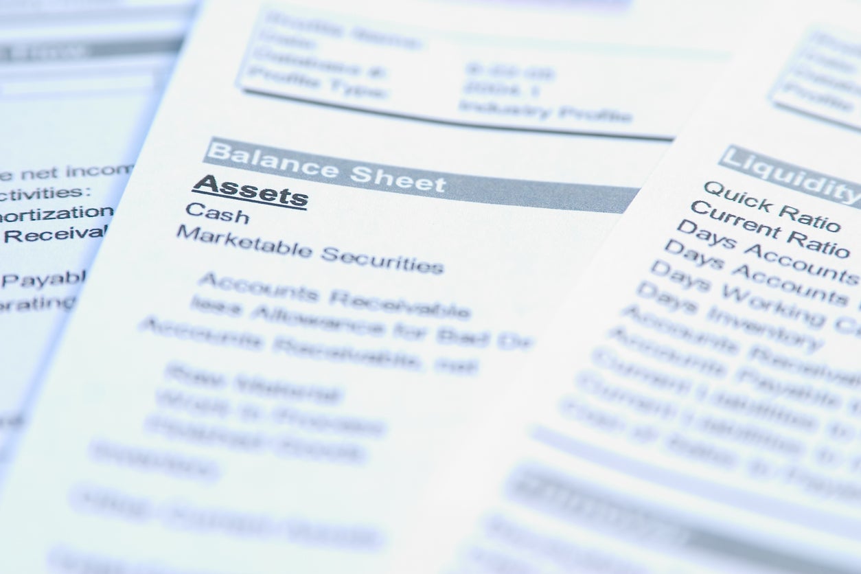 Financial documents with focus on a word "Assets. Very easy to shift colours.