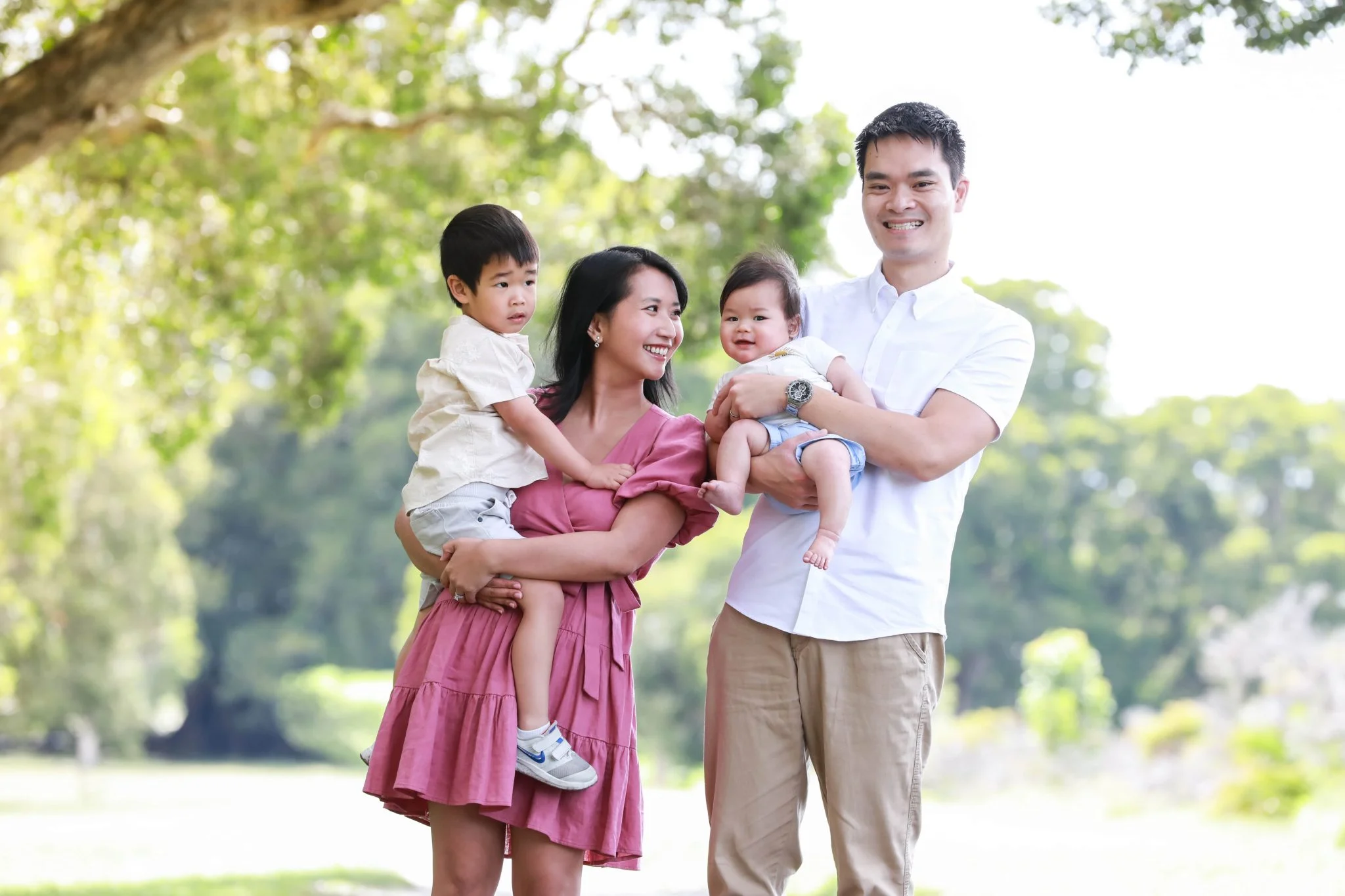 Kitty, holding eldest son Liam, alongside husband Philip and youngest son Oliver.