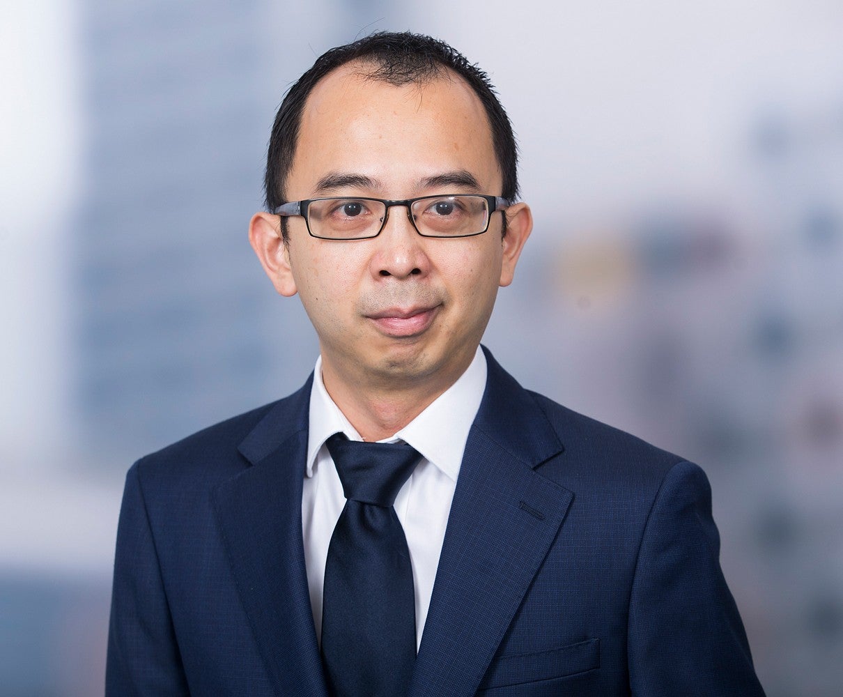 Headshot of a man wearing a suit