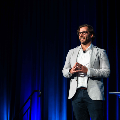 Corey Barker, Managing Director of See. Be. Consulting, presenting at the 2026 All Actuaries Summit.