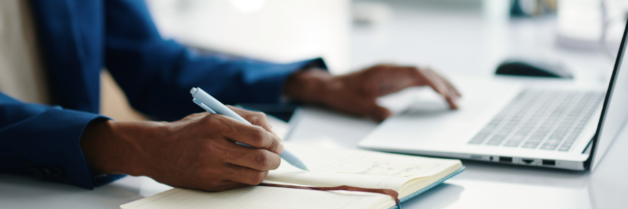 Image of hands, working at a laptop