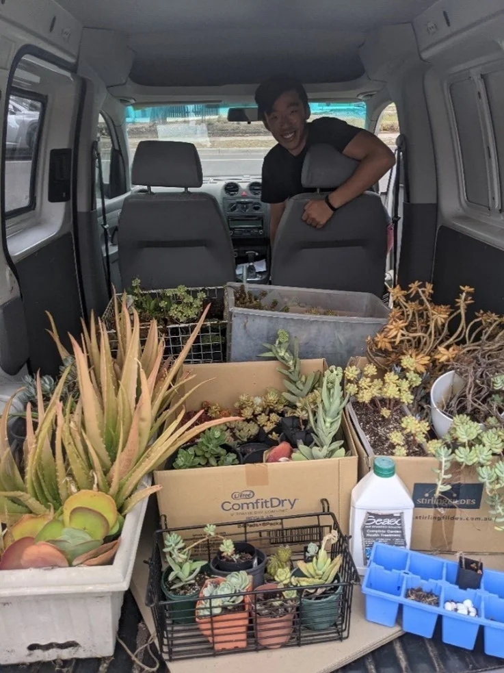 Harrison transporting his collection of plants.