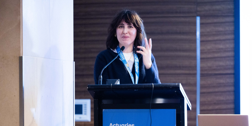 A photo of Sarah Wood presenting at the 2025 All Actuaries Summit