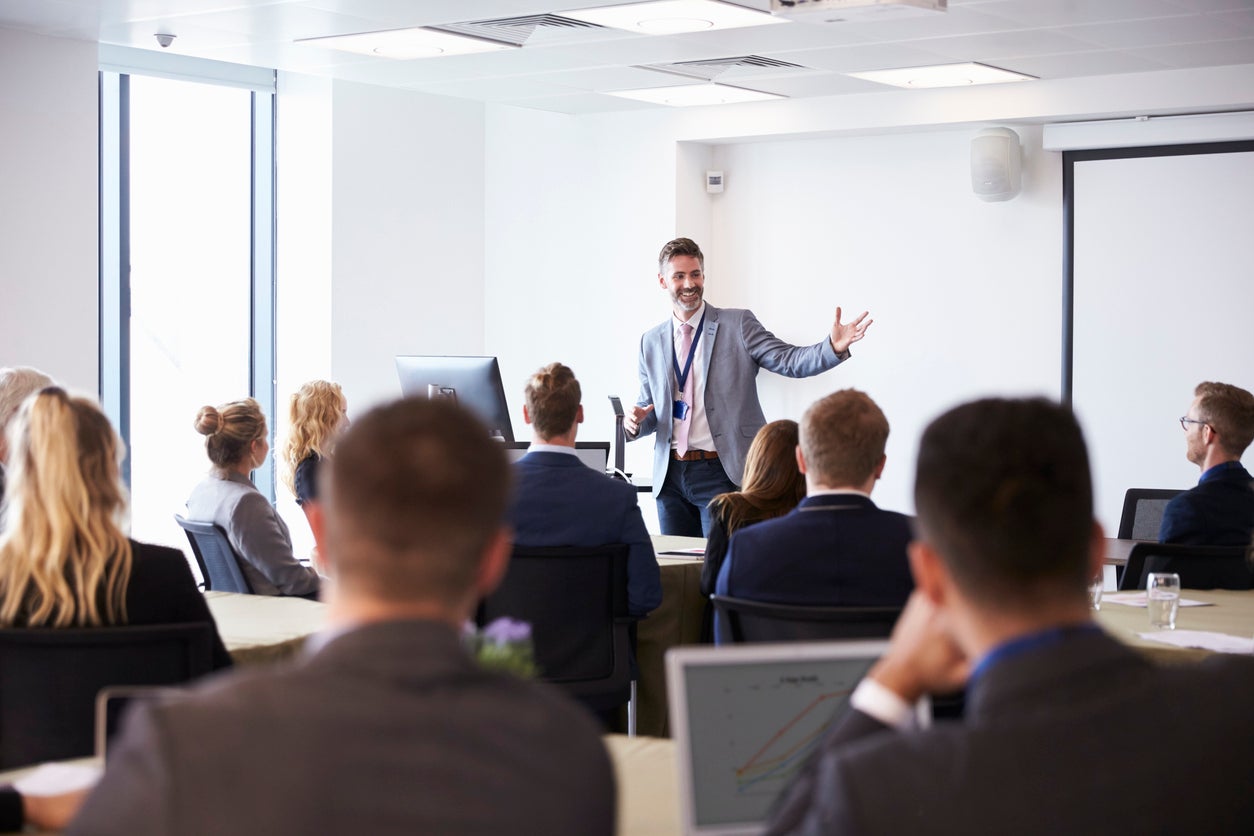 Businessman Making Presentation At Conference