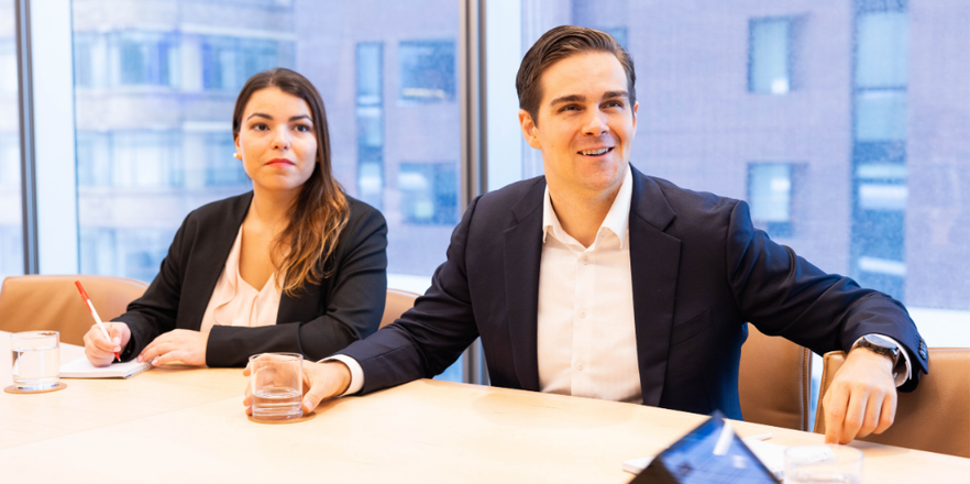 Two actuaries in a conference room