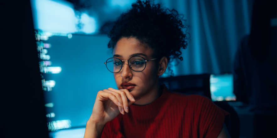 Young Hispanic woman in technology career, authentic portrait of programmer or cybersecurity professional