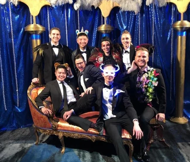 Ricky attending a networking event at an LGBT charity ball with co-workers.