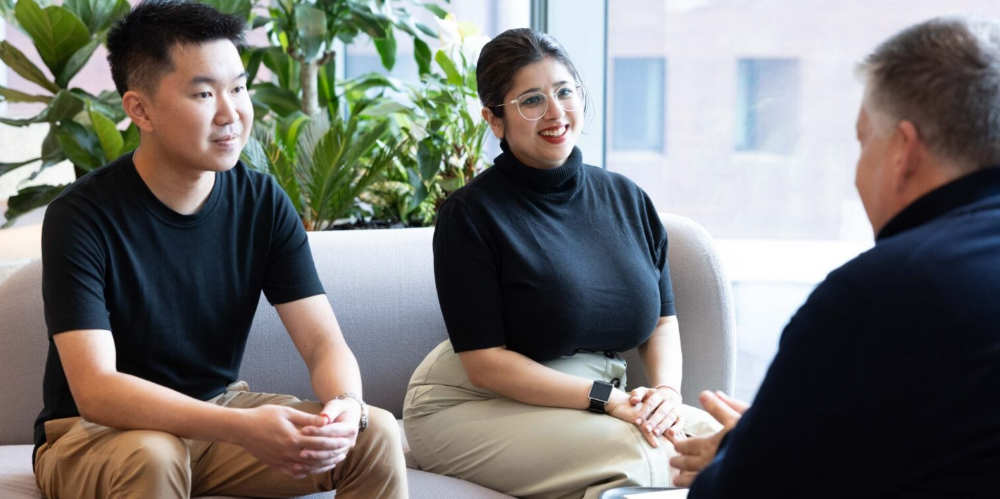 A photo of colleagues in conversation.