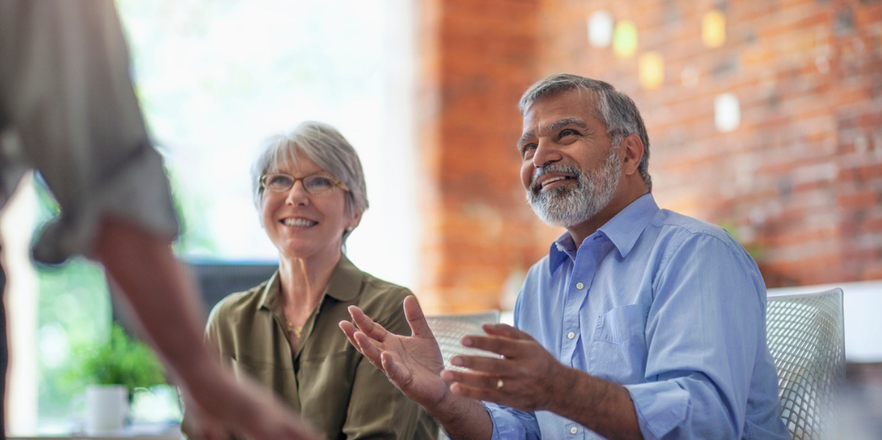 Mature man and woman smiling.