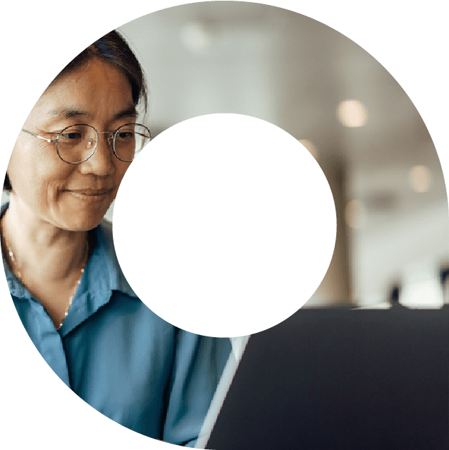 Woman typing on laptop within a viewfinder shape