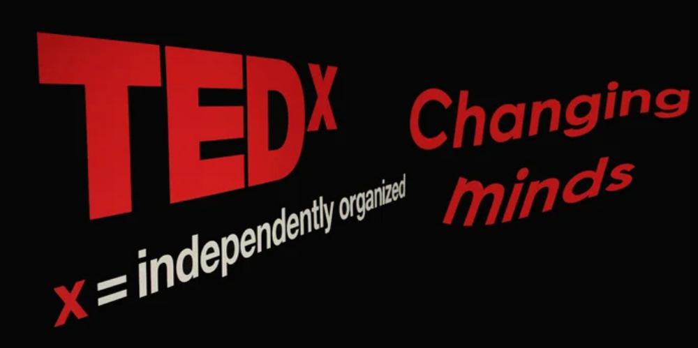 TEDx Sydney signage displaying the event theme "Changing Minds"