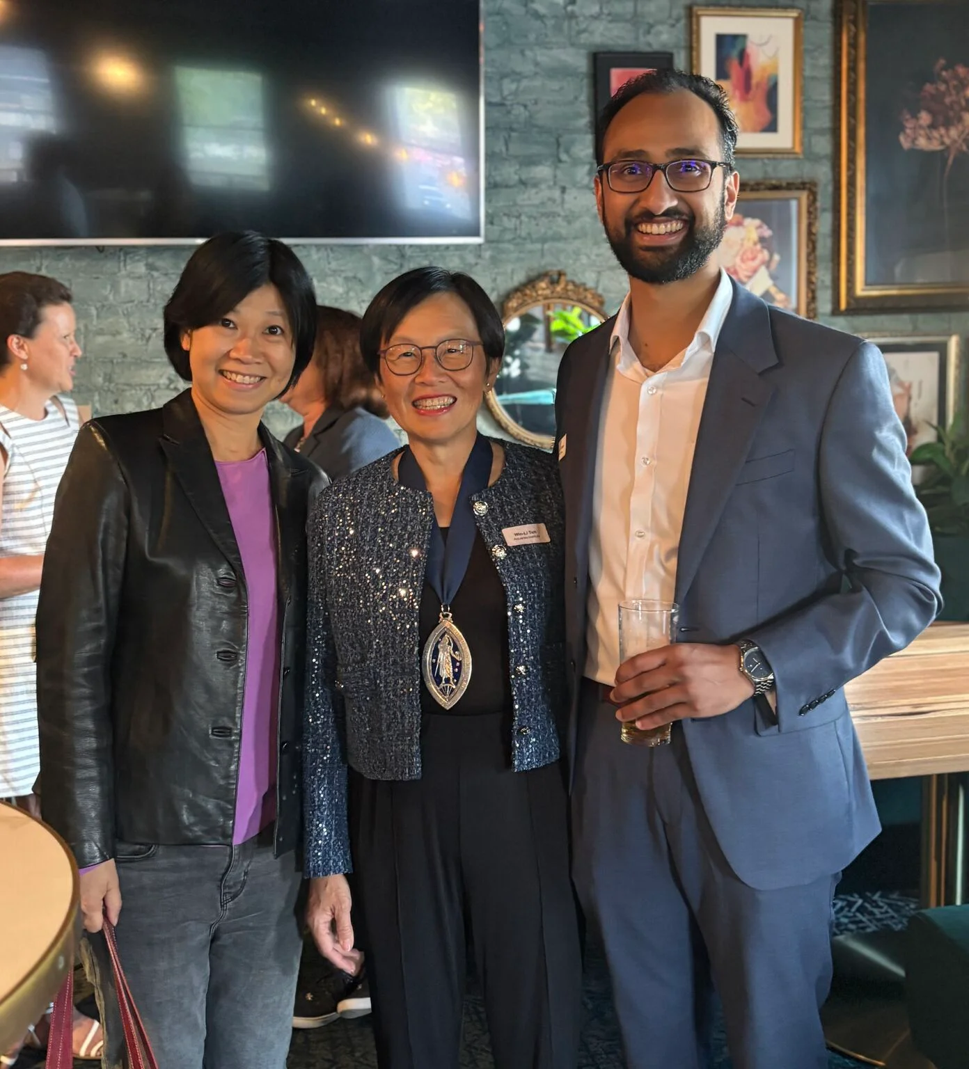 Win-Li with 2025 Actuary of the Year Iris Lun (left) and Rohan John (right) in Melbourne, Australia