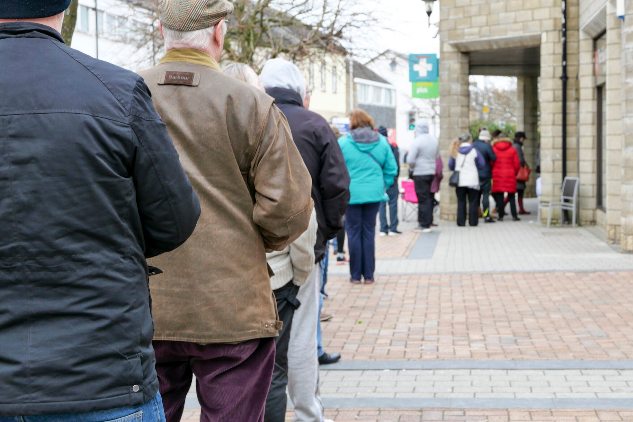 21st March 2020: Long queue of people outside a small pharmacy, in Penicuik town centre in Midlothian in Scotland. People, including the elderly and vulnerable are trying to pick up their prescriptions, as people panic over the Coronavirus and put added pressure on GP surgeries requesting prescriptions before they and others self isolate. Waiting times of up to an hour waiting to enter two people at a time.