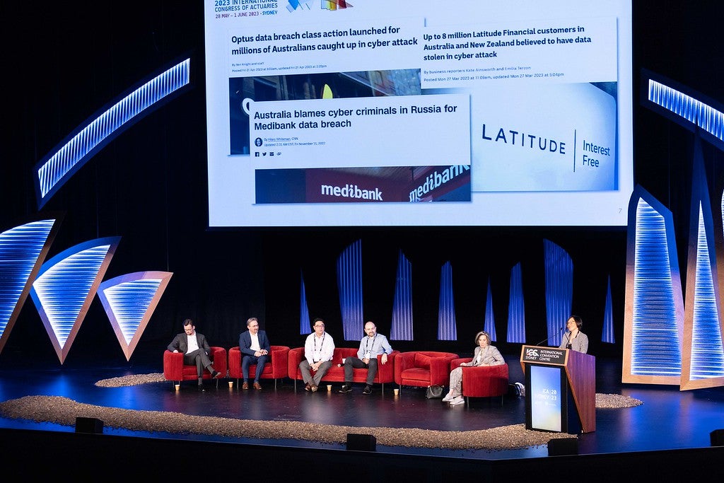 Photo of conference presentation panel