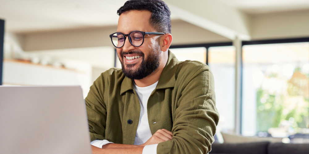 Man sitting at laptop.