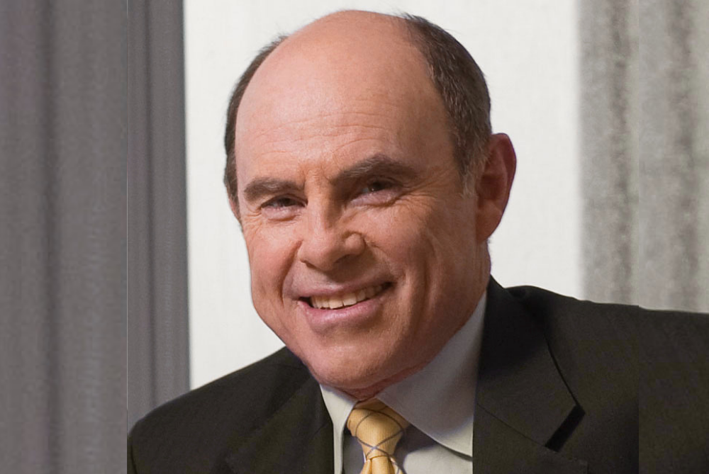 Business man smiling at camera, head and shoulders photos with brown suit, and yellow striped tie