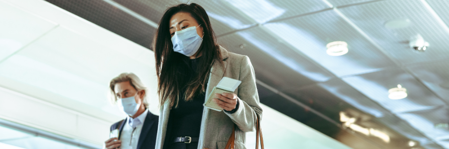 image of a man and women b oth wearing face masks 