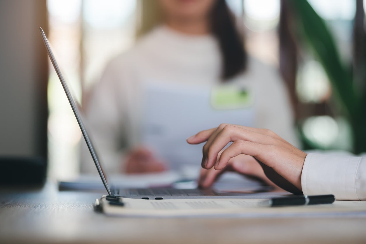 business people use laptops working through an online network,to analyze and improve corporate strategies Manage financial and marketing documents company growth information data management